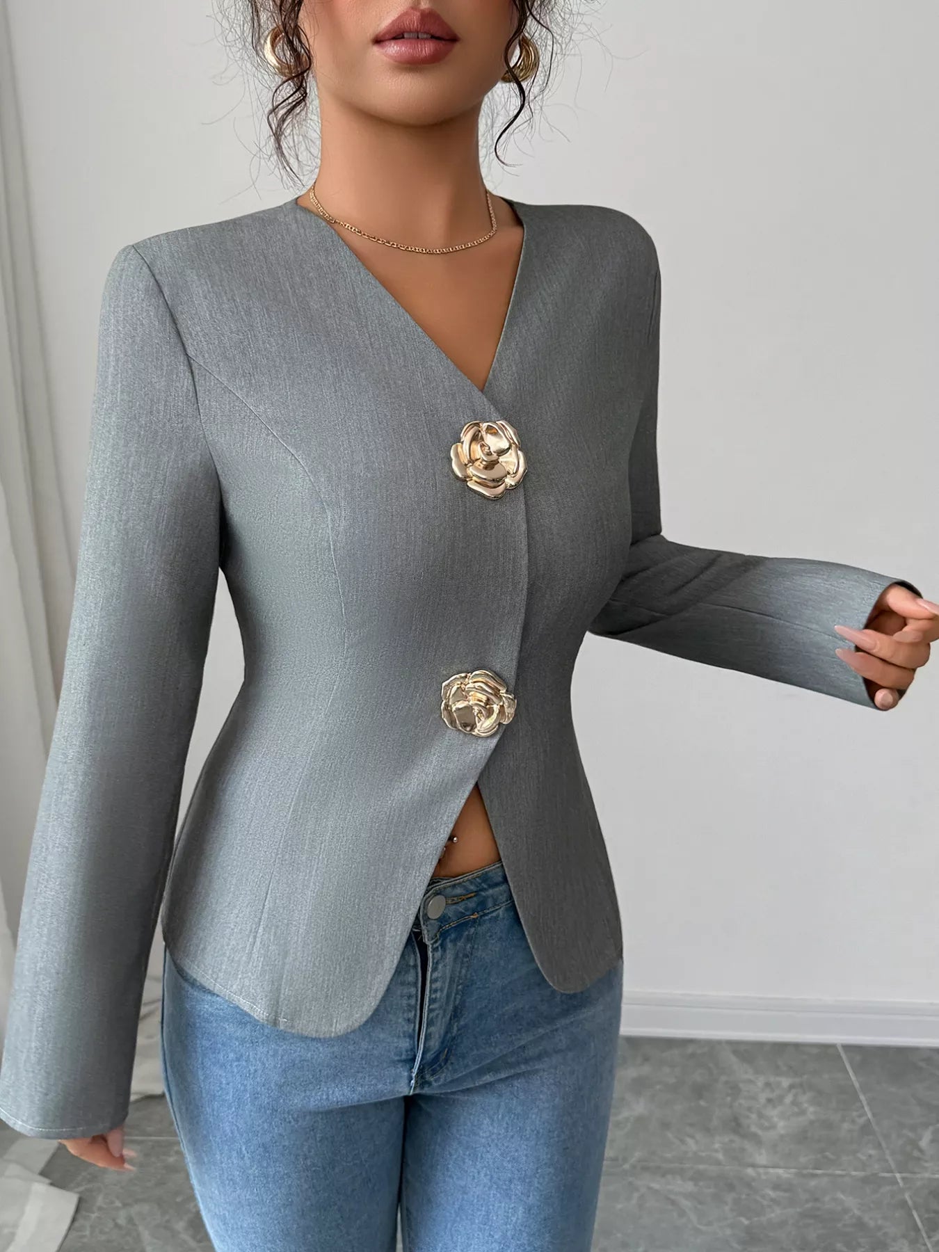 Model wearing flower button long sleeve blazer