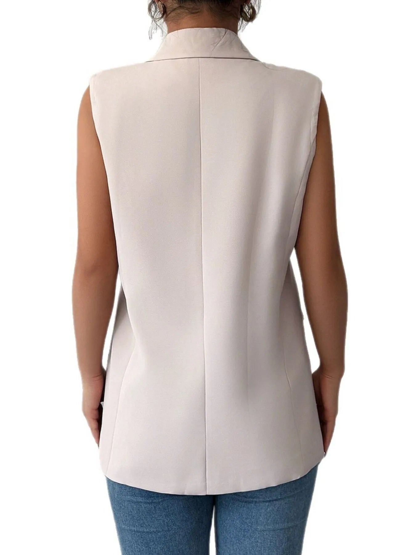 Back view of a model wearing the One Button Sleeveless Blazer, showcasing its sleek design and modern style.