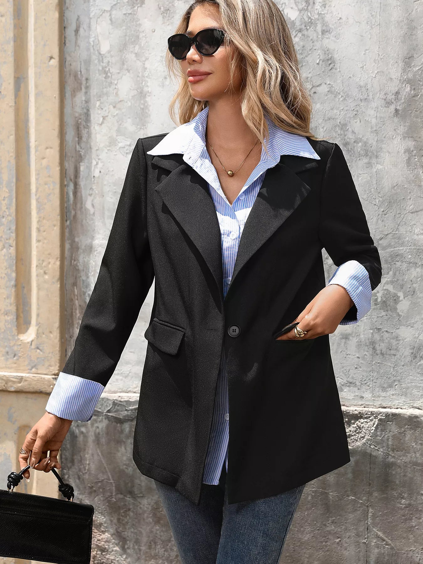 Model wearing striped collar fake two-piece blazer