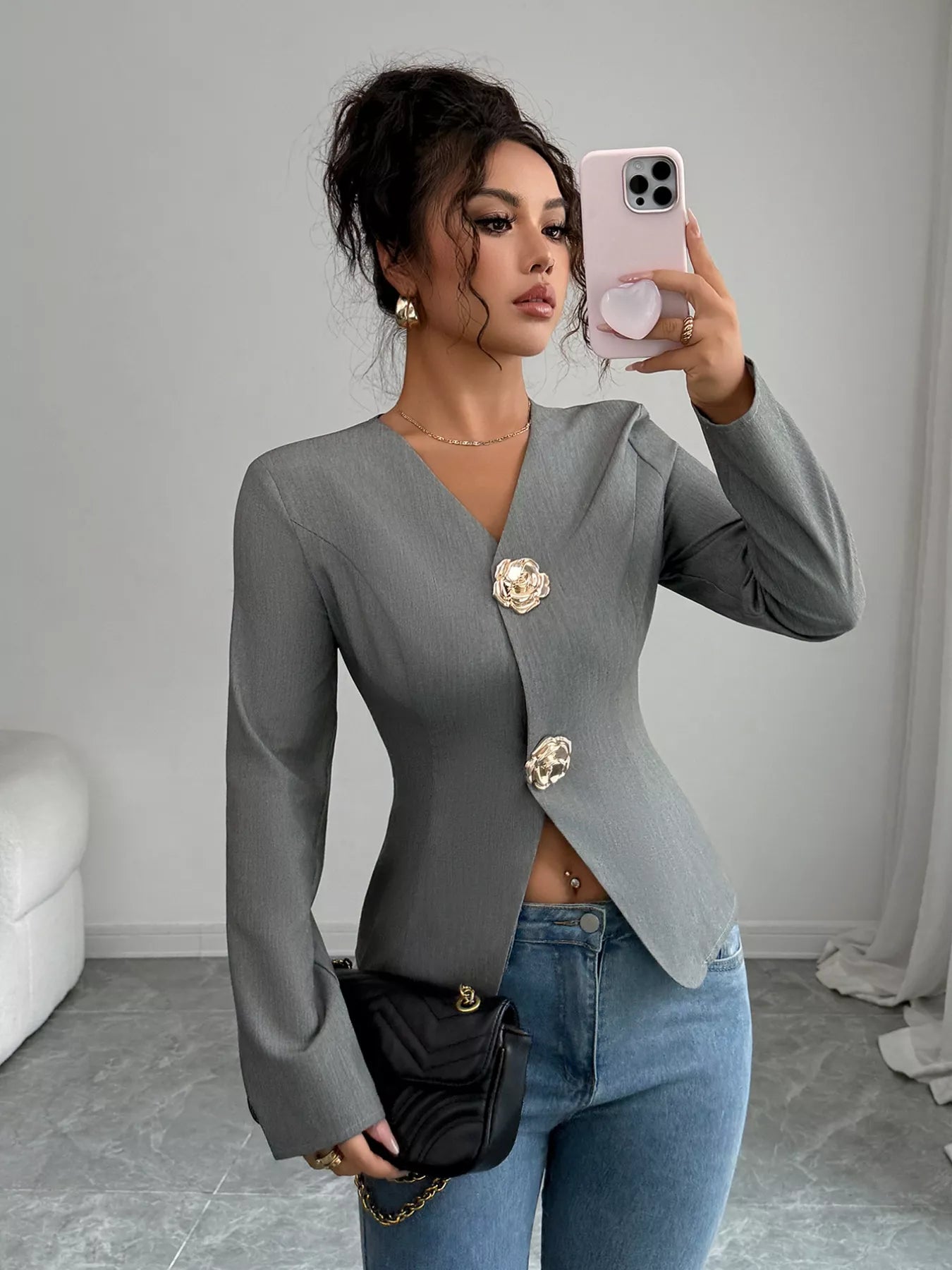 Model wearing flower button long sleeve blazer