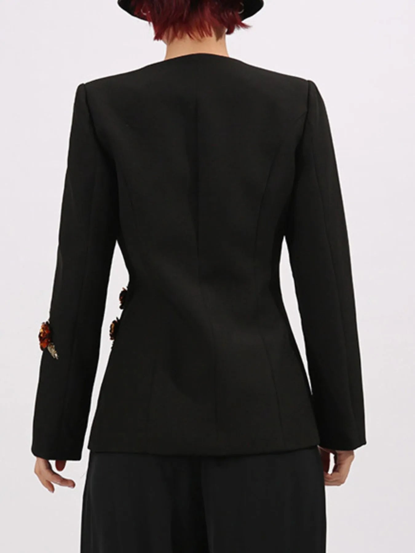 Back view of embroidered blazer with sleeve detail
