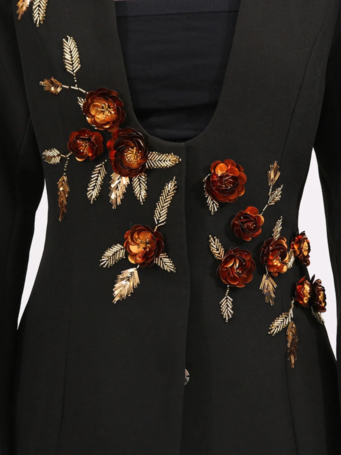 Front view of embroidered long sleeve blazer